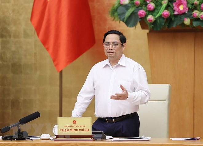 Thủ tướng Phạm Minh Chính phát biểu về tình hình triển khai thực hiện Nghị quyết số 54-NQ/TW của Bộ Chính trị về việc xây dựng và phát triển tỉnh Thừa Thiên-Huế đến năm 2030, tầm nhìn đến năm 2045. (Ảnh: Dương Giang/TTXVN)