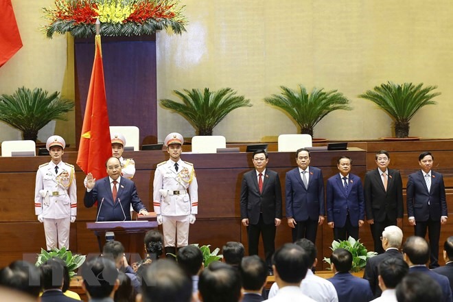 Chủ tịch nước Nguyễn Xuân Phúc tuyên thệ nhậm chức. (Ảnh: Văn Điệp/TTXVN)