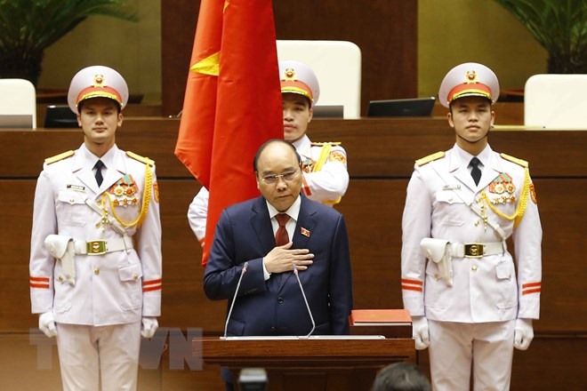 Chủ tịch nước Nguyễn Xuân Phúc tuyên thệ nhậm chức. (Ảnh: Văn Điệp/TTXVN)
