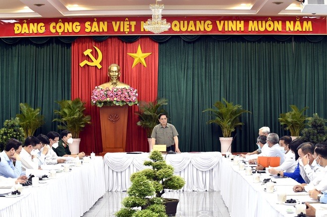 Thủ tướng Phạm Minh Chính chủ trì cuộc làm việc với lãnh đạo tỉnh Đồng Nai sau cuộc thị sát công tác chống dịch trên địa bàn (ảnh: VGP).