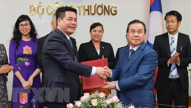Việt Nam-Lào tăng cường hợp tác thương mại, công nghiệp và năng lượng. (Ảnh: Trần Việt/TTXVN)