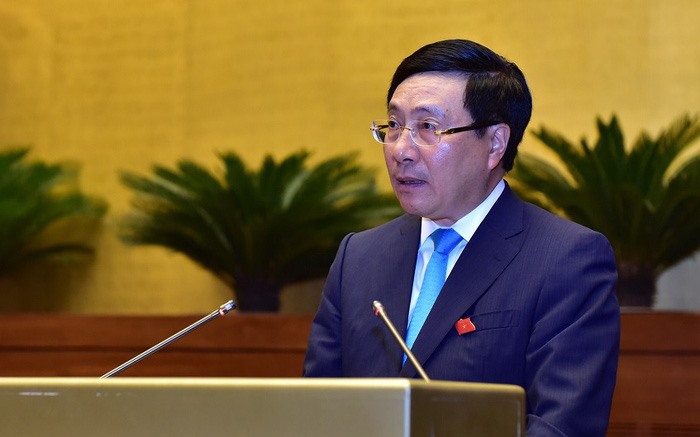 Phó Thủ tướng Chính phủ Phạm Bình Minh báo cáo trước Quốc hội. Ảnh quochoi.vn