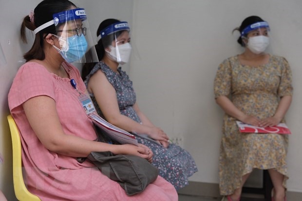Các thai phụ đăng ký tiêm vaccine phòng COVID-19 tại Bệnh viện Hùng Vương Thành phố Hồ Chí Minh ngày 12/8. (Ảnh: TTXVN phát)