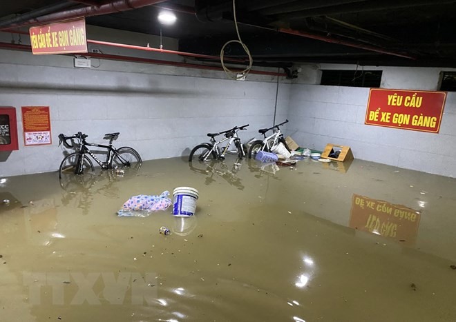 Nước ngập khu nhà trọ trên đường Hồ Xuân Hương, quận Ngũ Hành Sơn, Đà Nẵng. Ảnh: Quốc Dũng/TTXVN