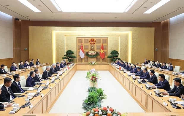 Quang cảnh buổi hội đàm giữa Thủ tướng Phạm Minh Chính và Thủ tướng Singapore Lý Hiển Long. (Ảnh: Dương Giang/TTXVN)